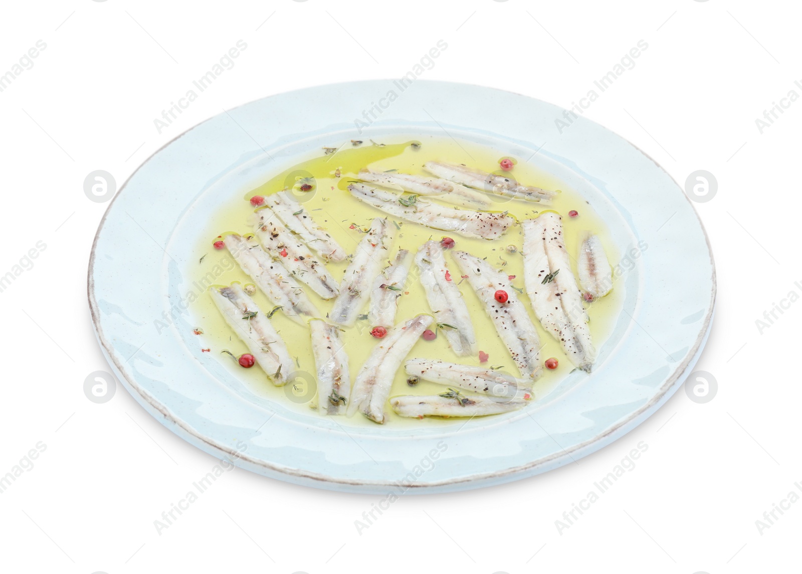 Photo of Tasty pickled anchovies with spices isolated on white