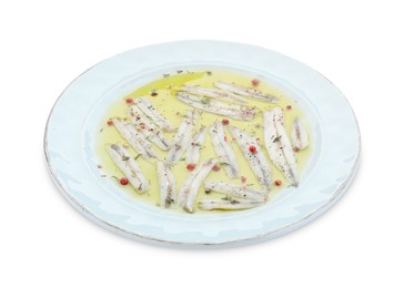 Photo of Tasty pickled anchovies with spices isolated on white