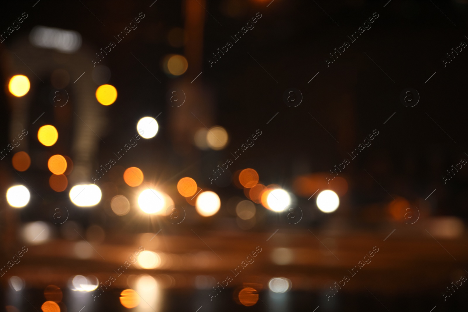 Photo of Blurred view of cityscape with bokeh effect. Night life