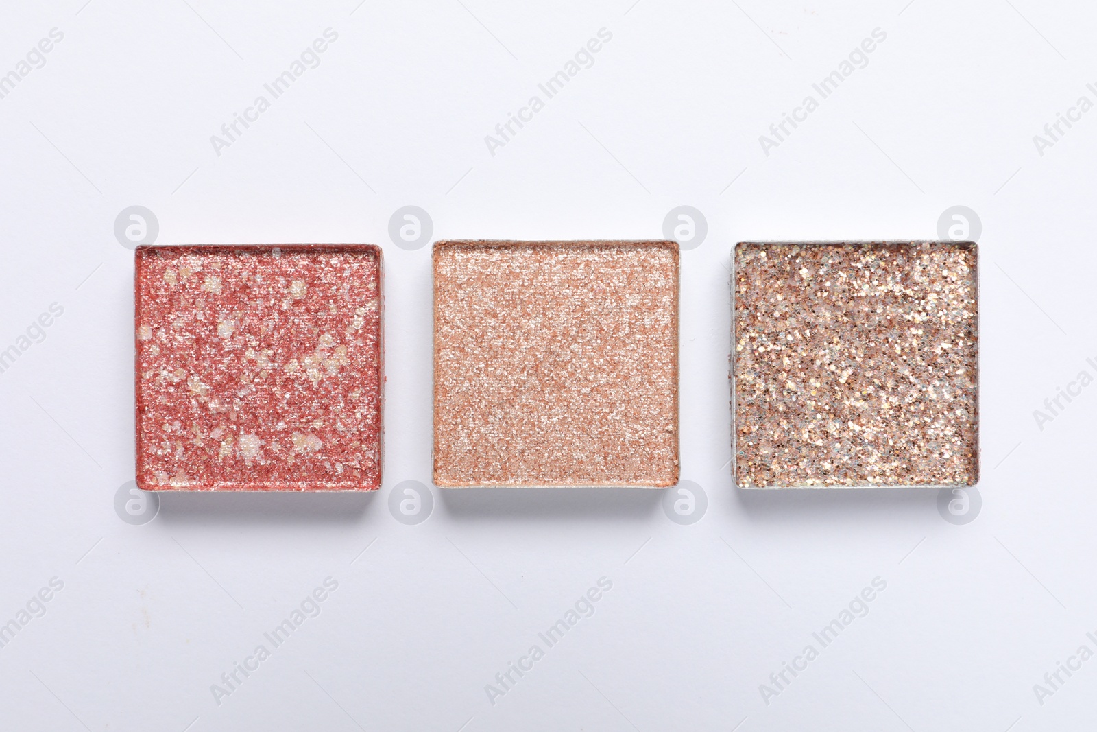 Photo of Beautiful eye shadow refill pans on white background, flat lay