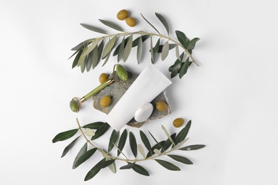 Flat lay composition with different cosmetic products and olives on white background
