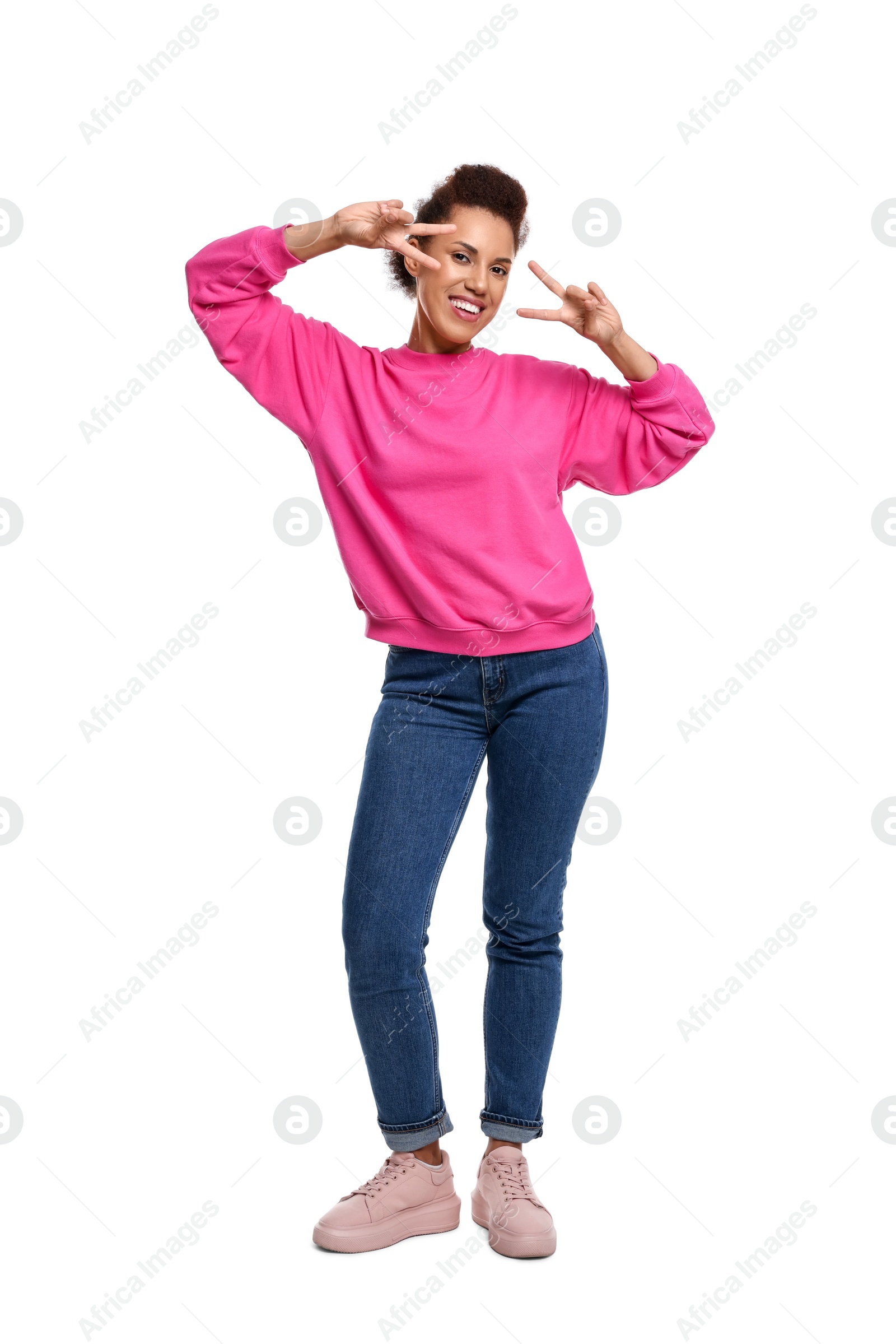 Photo of Happy young woman dancing on white background