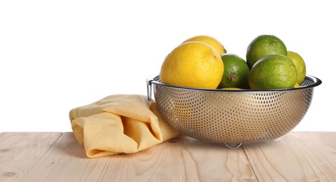Photo of Fresh fruits in colander and napkin on wooden table against white background