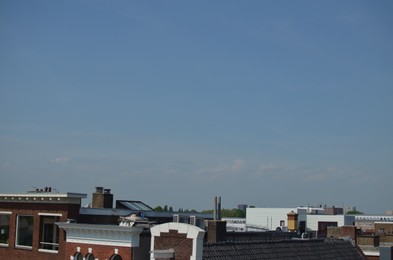 Picturesque view of city with beautiful buildings under blue sky