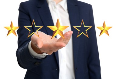 Quality evaluation. Businesswoman showing virtual golden stars on white background, closeup