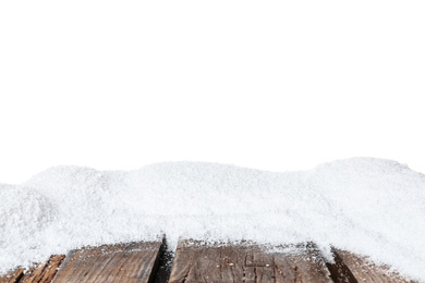 Photo of Heap of snow on wooden surface against white background
