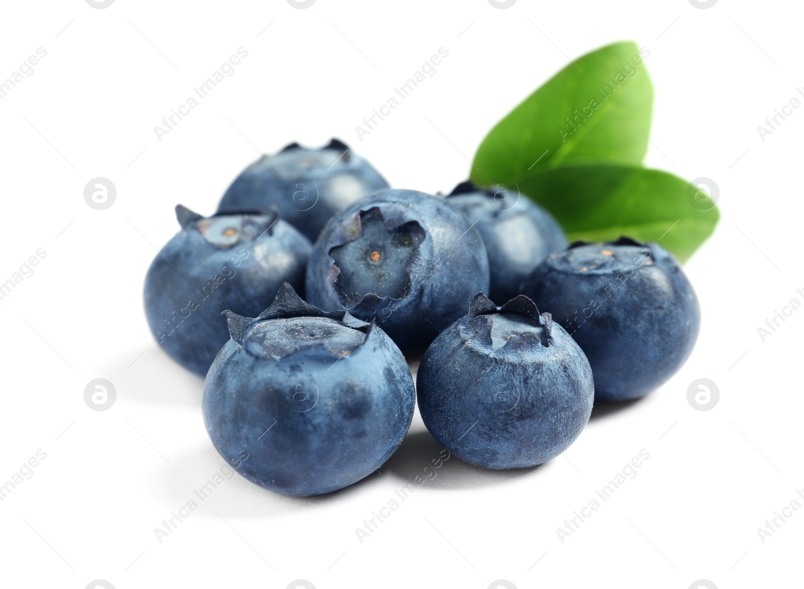 Photo of Fresh raw tasty blueberries with leaves isolated on white