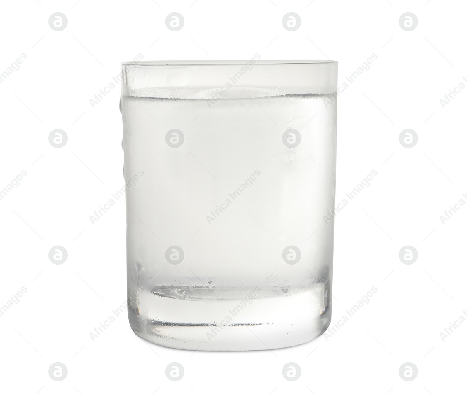 Photo of Shot glass of vodka with ice isolated on white