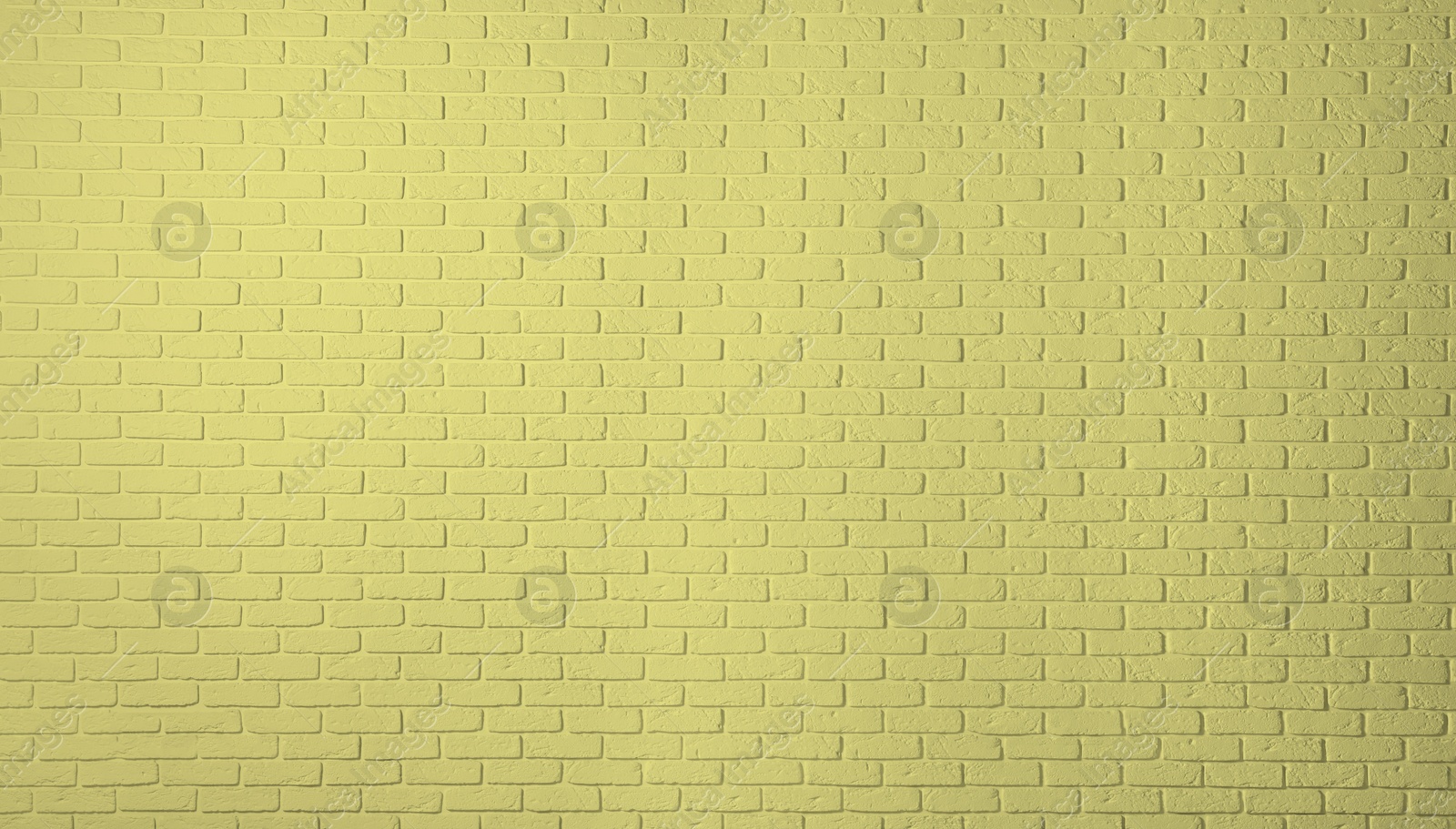 Image of Texture of pale golden rod color brick wall as background