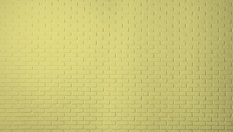 Image of Texture of pale golden rod color brick wall as background