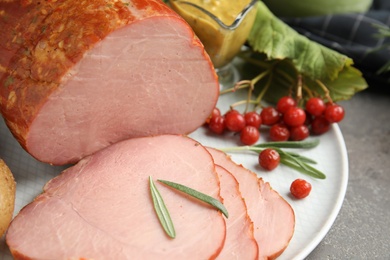 Photo of Delicious ham served on table, closeup. Christmas dinner