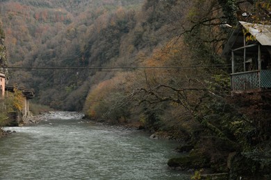 Picturesque view of beautiful river and tree house in mountains