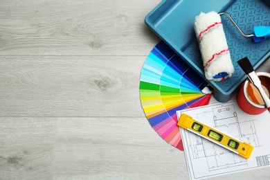 Set of decorator's tools on wooden floor