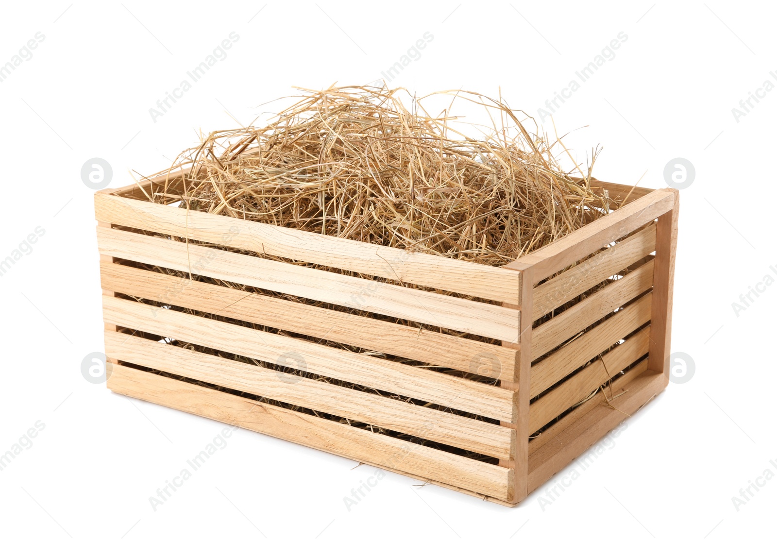 Photo of Dried hay in wooden crate on white background