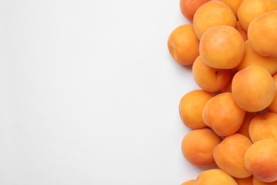 Delicious ripe sweet apricots on white background, top view