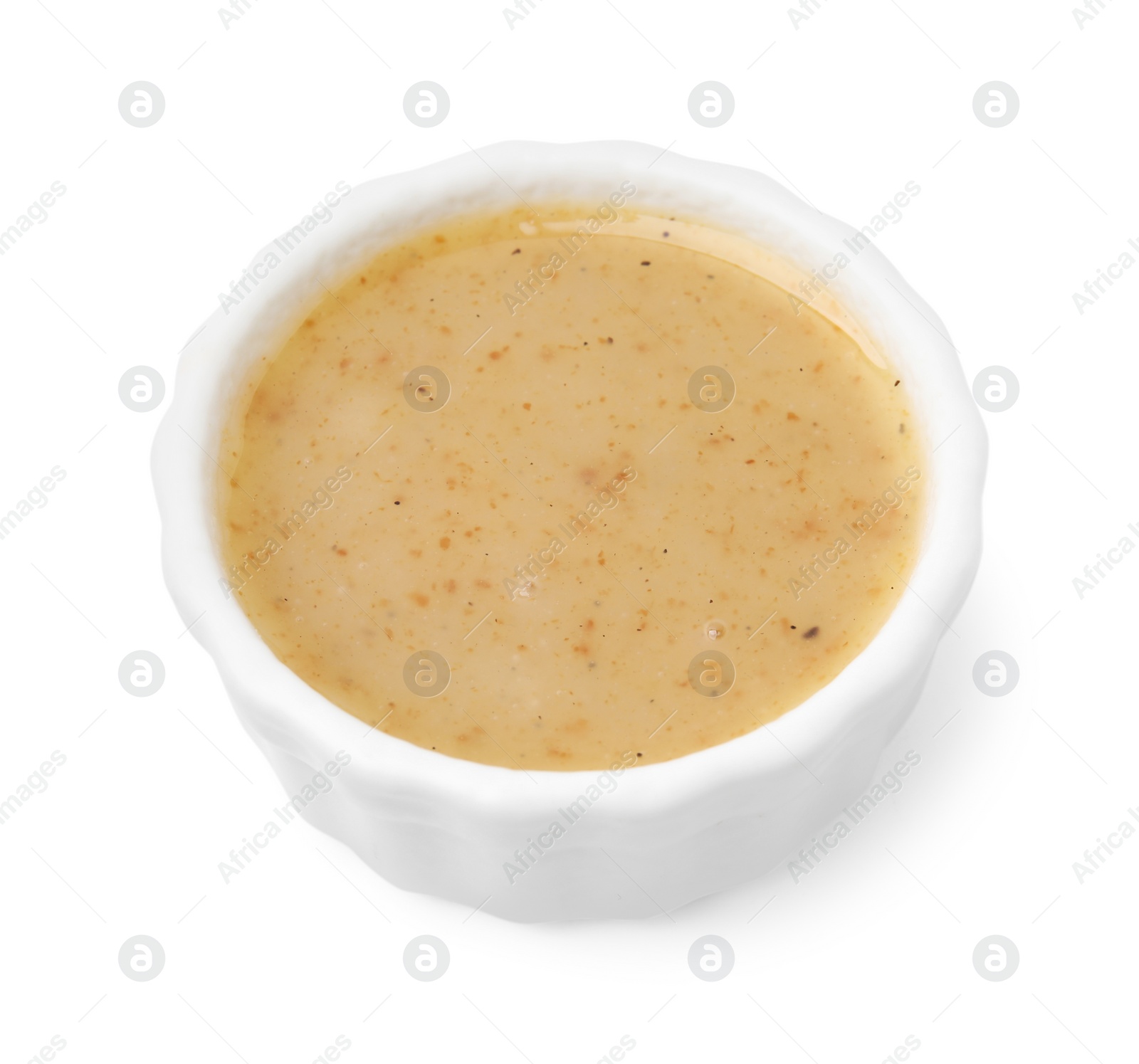 Photo of Delicious turkey gravy in bowl isolated on white