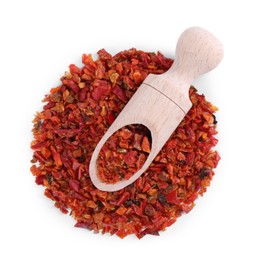 Photo of Aromatic spice. Pile of red chili pepper flakes and scoop isolated on white, top view