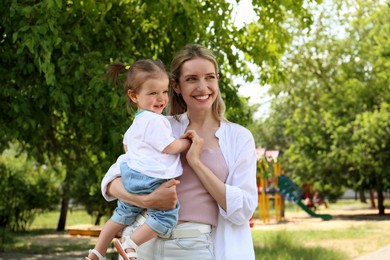Photo of Happy mother with her daughter spending time together in park