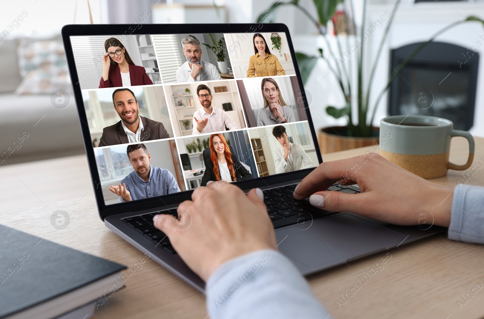 Image of Woman participating in webinar via laptop at table, closeup