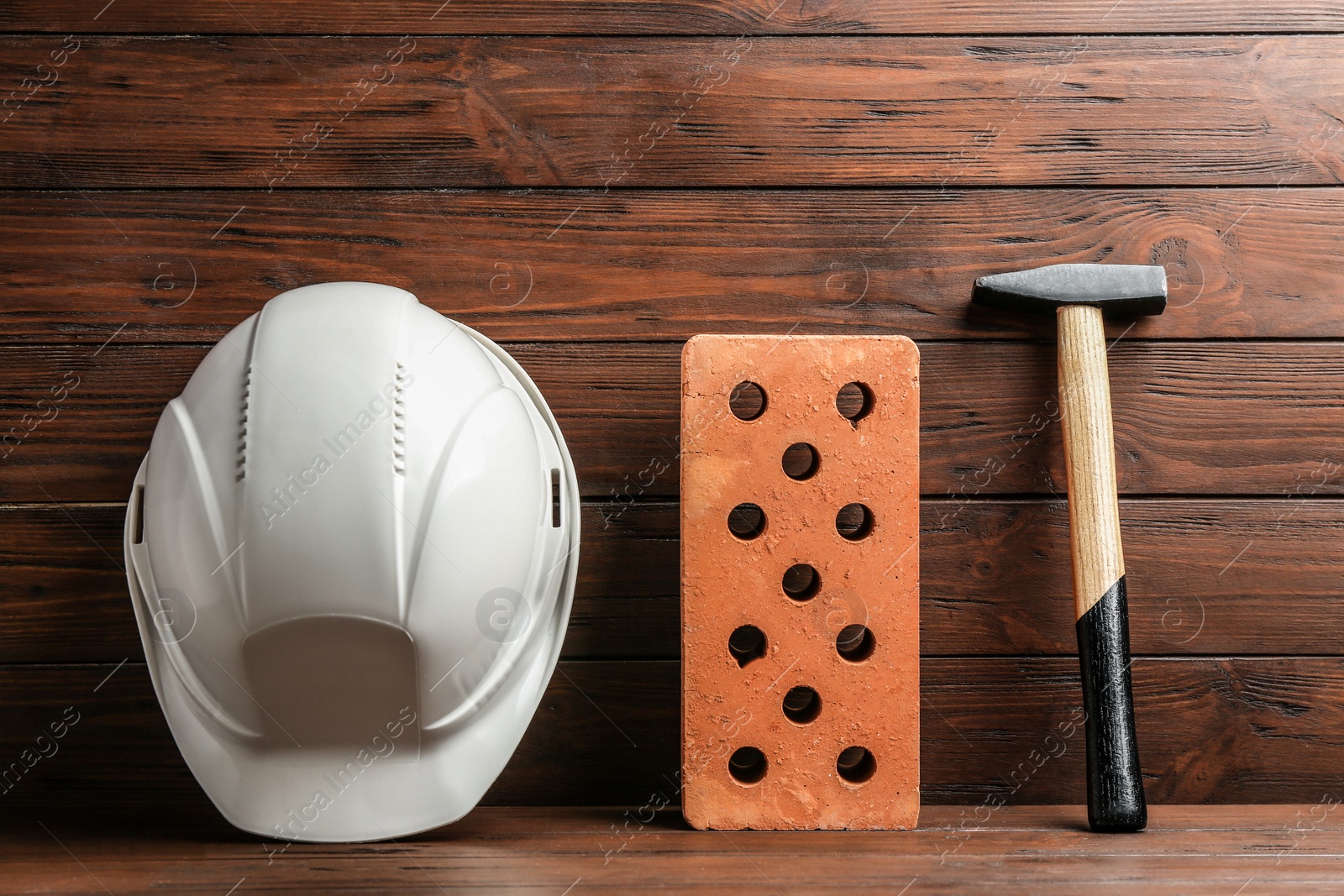 Photo of Composition with construction tools on table against wooden background