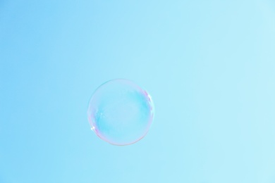 Beautiful translucent soap bubble outdoors on sunny day. Space for text