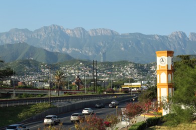 Photo of Picturesque view of city and highway in mountains