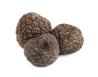 Photo of Fresh whole black truffles isolated on white