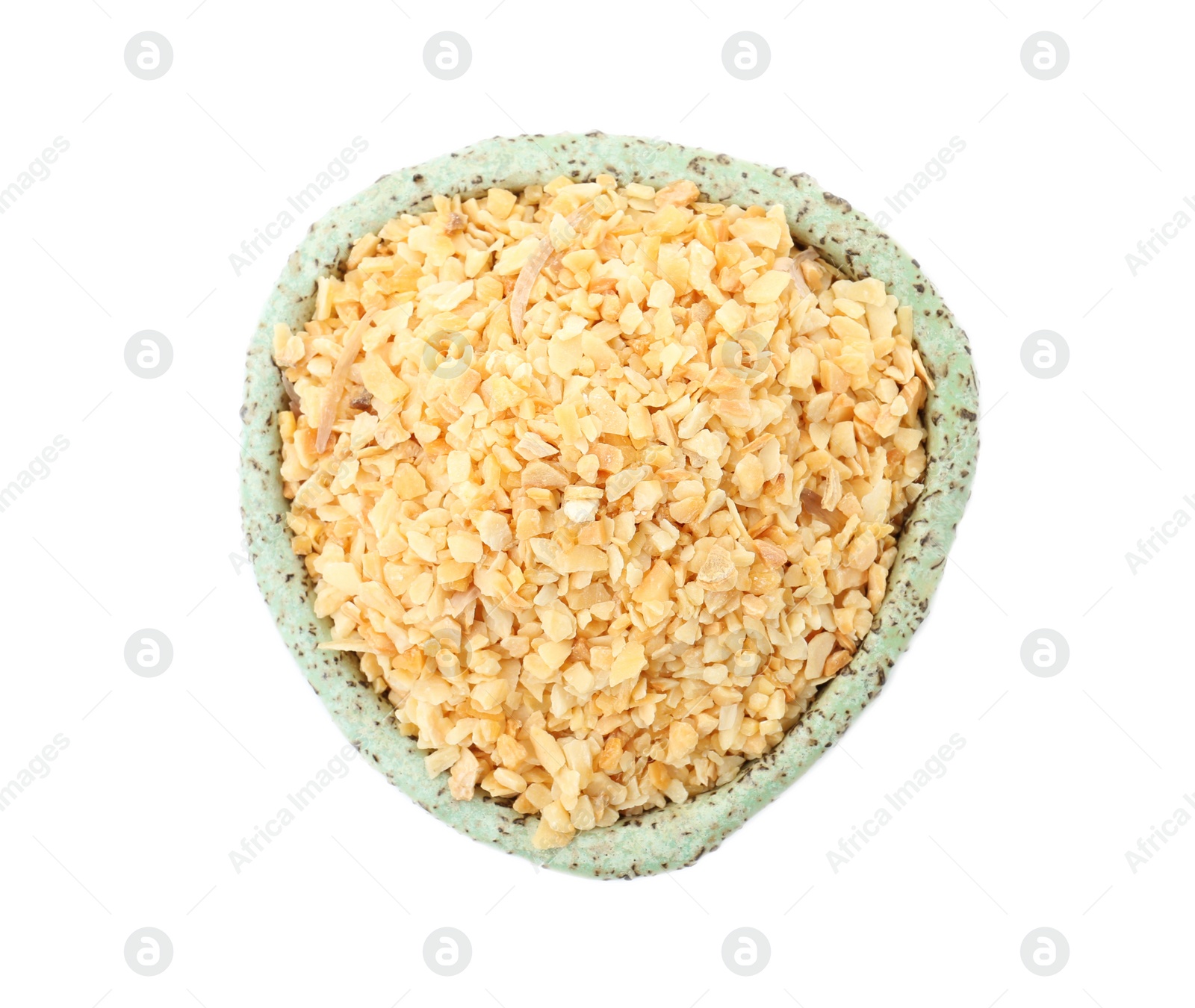 Photo of Bowl of granulated dry garlic on white background, top view