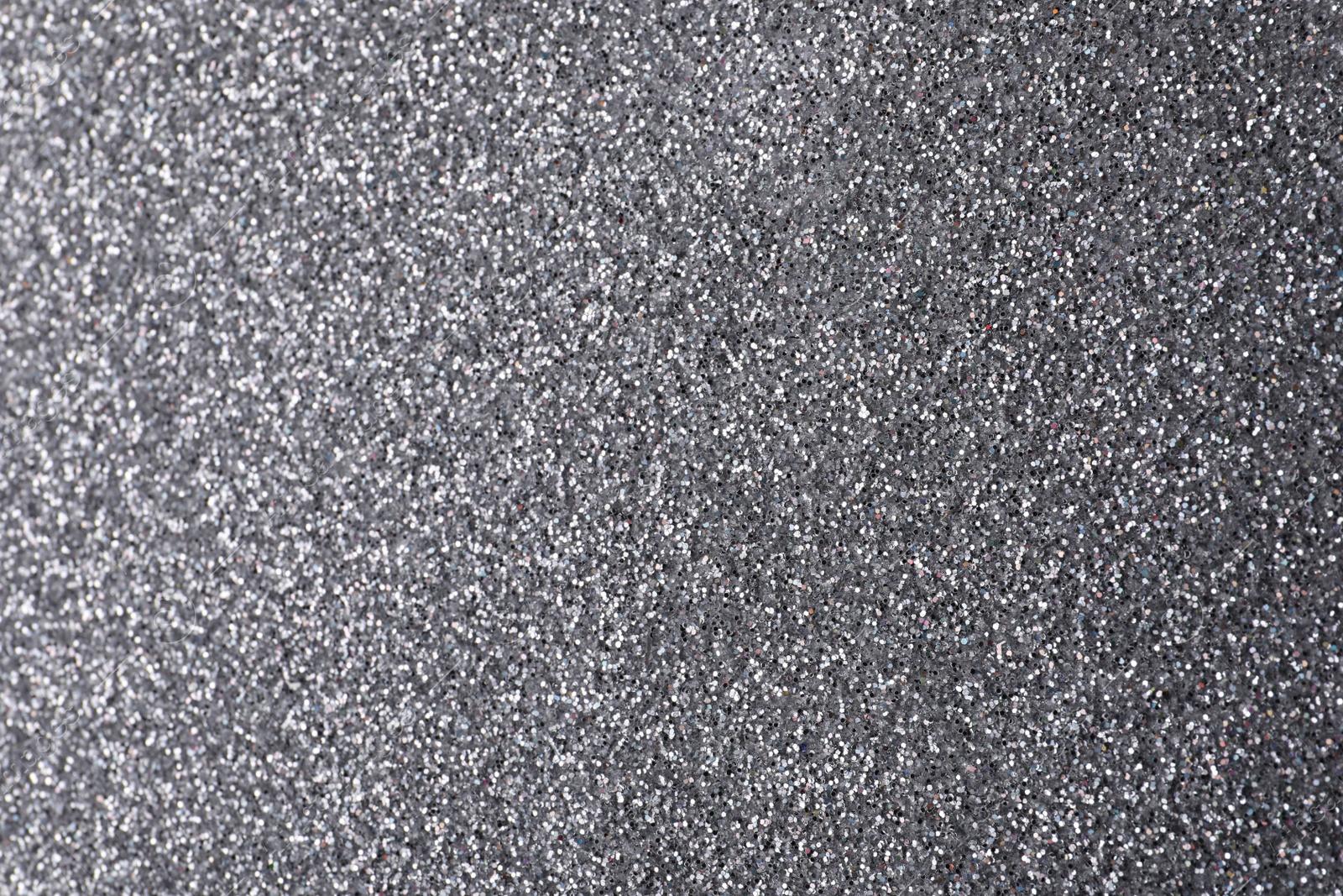 Photo of Beautiful shiny grey glitter as background, closeup