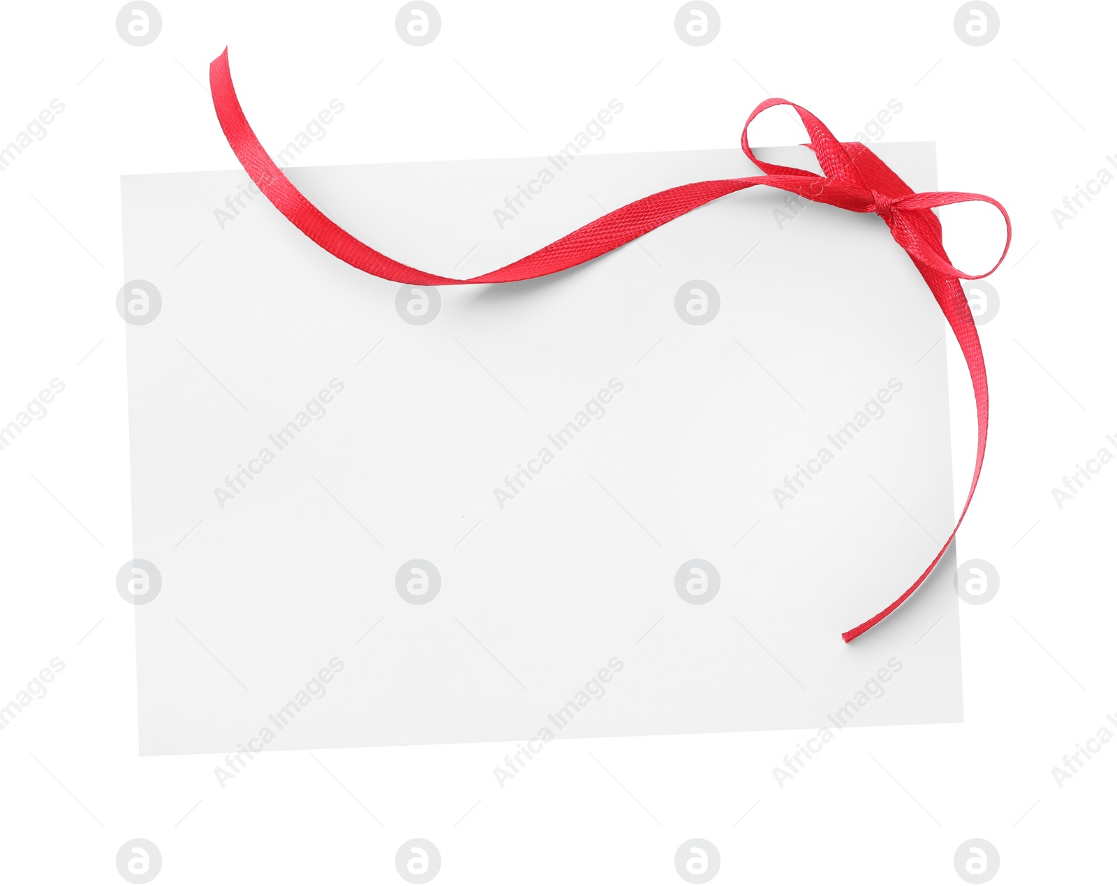 Photo of Blank card with red bow on white background, top view. Valentine's Day celebration