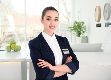 Female receptionist at workplace in hotel