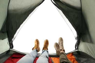 Photo of Closeup of couple in camping tent on white background, view from inside