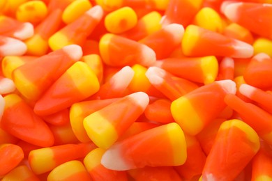 Photo of Delicious colorful candies as background, closeup. Halloween sweets