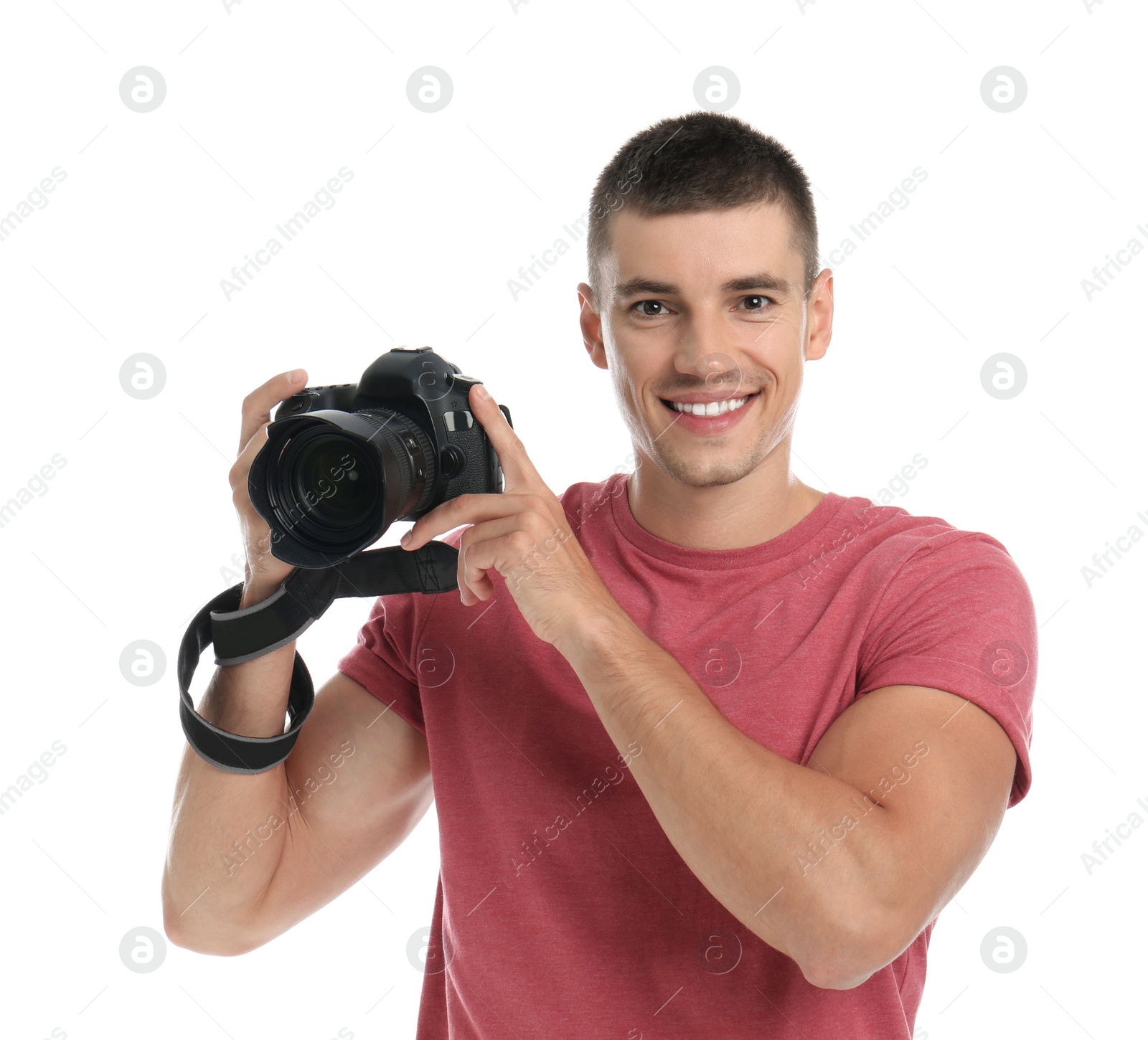 Photo of Young photographer with professional camera on white background