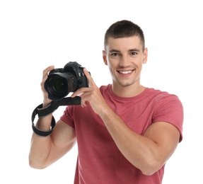 Young photographer with professional camera on white background
