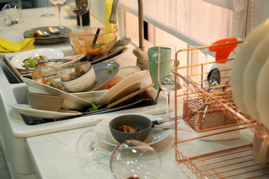 Photo of Dirty dishes in kitchen after new year party