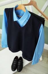 School uniform for boy on rack indoors