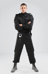 Photo of Male security guard in uniform on color background