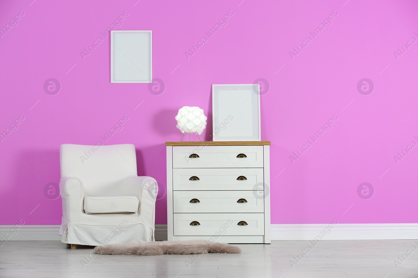 Photo of Stylish room interior with chest of drawers and space for text