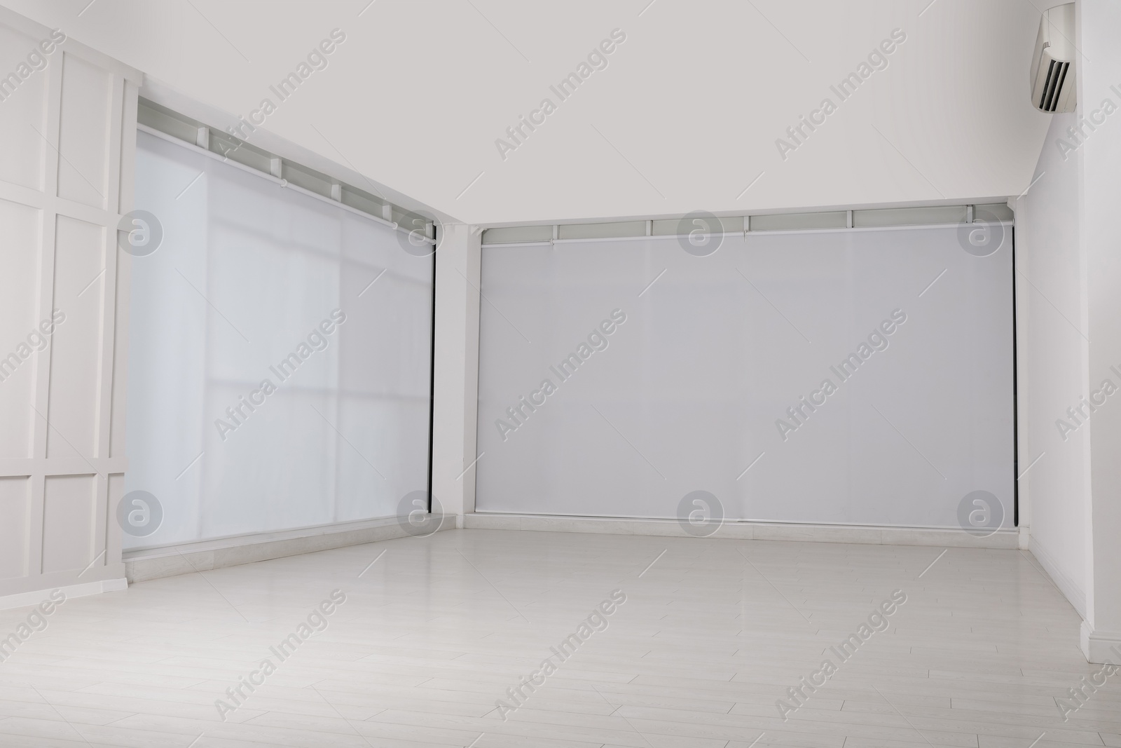 Photo of Empty room with beige walls and laminated flooring