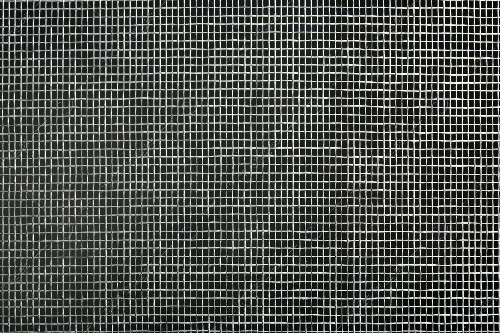 Photo of Closeup view of mosquito window screen on grey background