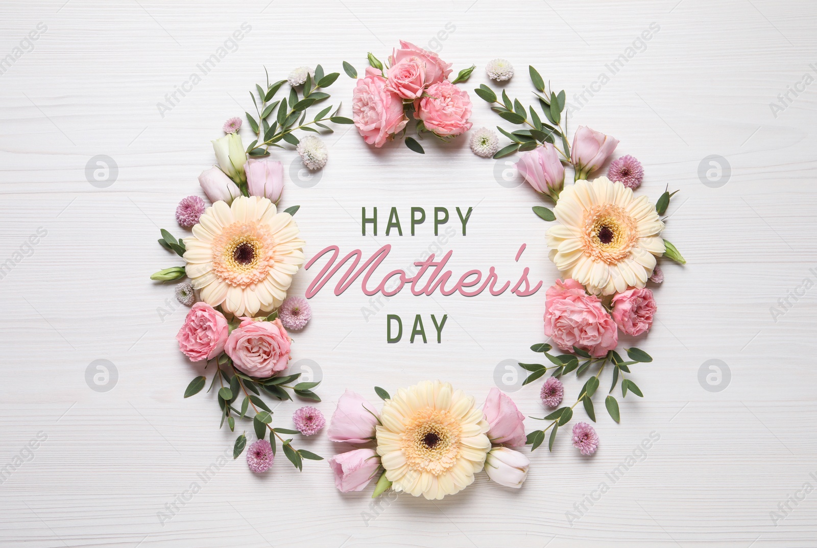 Image of Happy Mother's Day. Greeting card with frame of beautiful flowers on white wooden background, flat lay