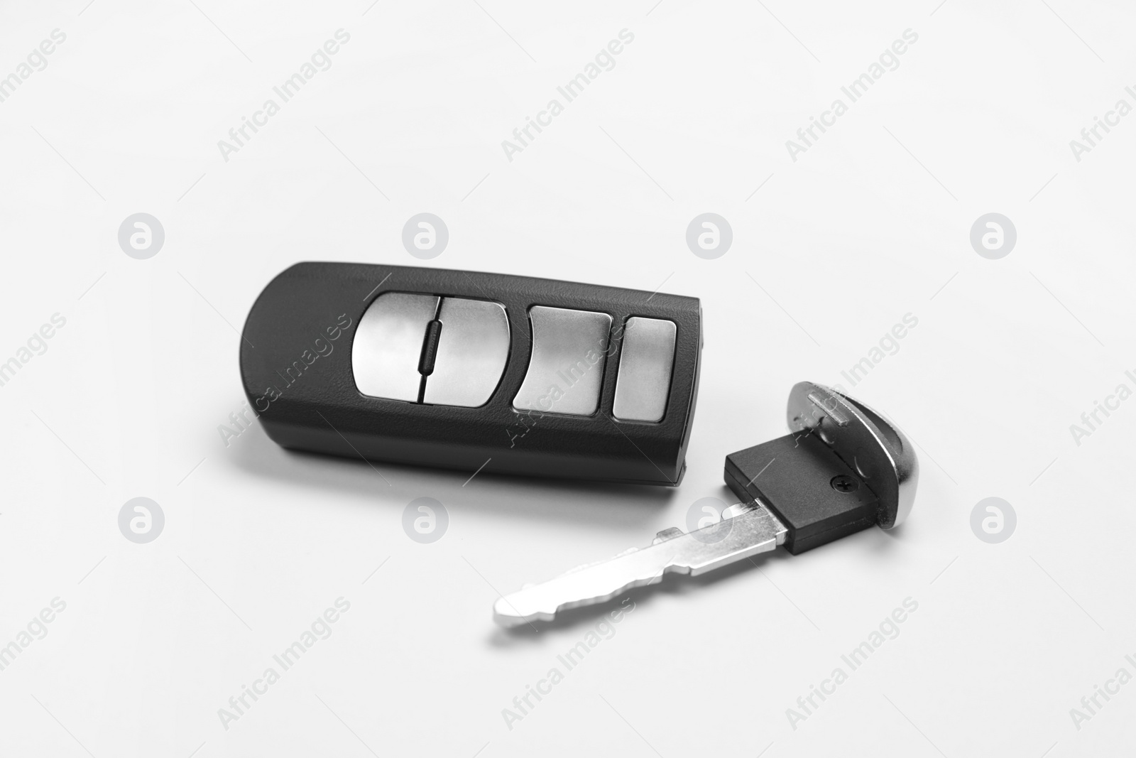 Photo of Car key with alarm system remote control on white background