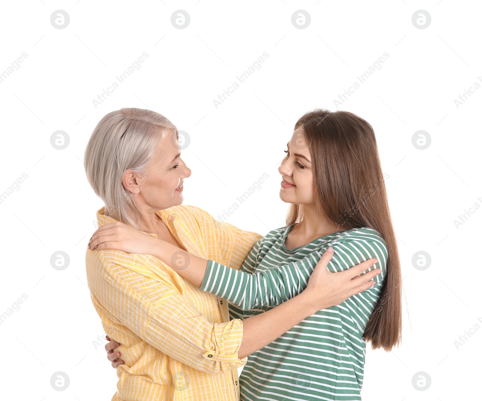 Photo of Portrait of young woman with her mature mother on white background