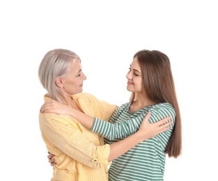 Photo of Portrait of young woman with her mature mother on white background