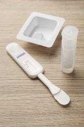 Photo of Disposable express test kit on wooden table