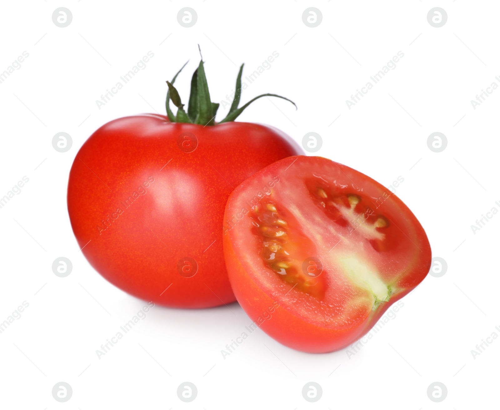 Photo of Tasty ripe tomatoes with leaves isolated on white