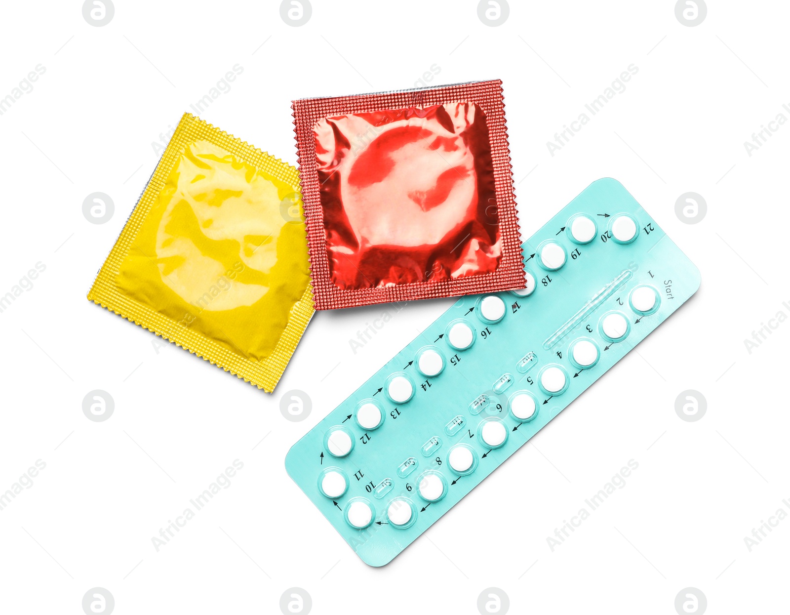 Photo of Condoms and birth control pills on white background, top view. Safe sex concept