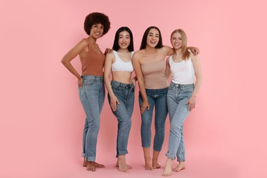 Portrait of beautiful young women on pink background