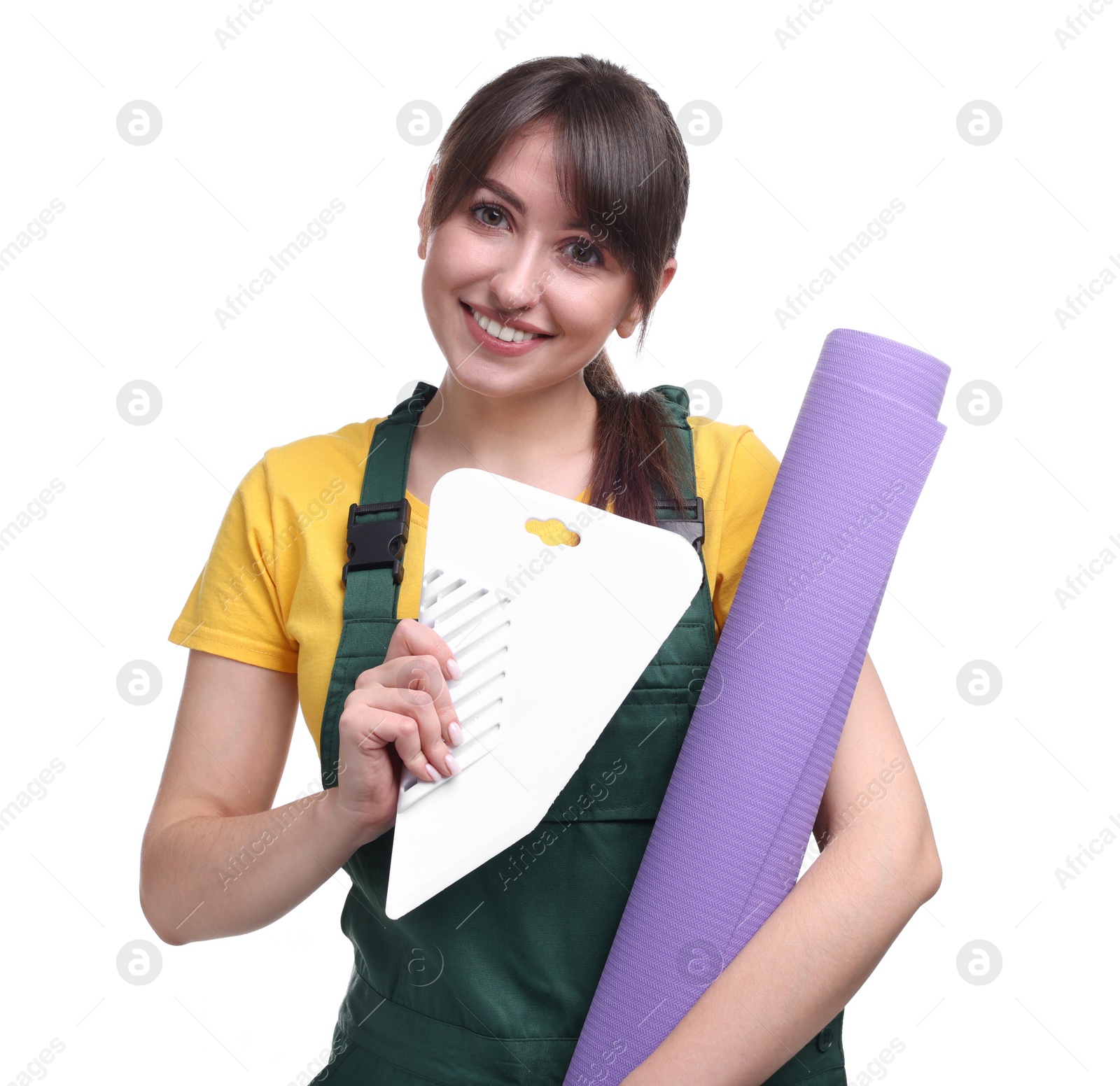 Photo of Beautiful woman with wallpaper roll and spatula on white background